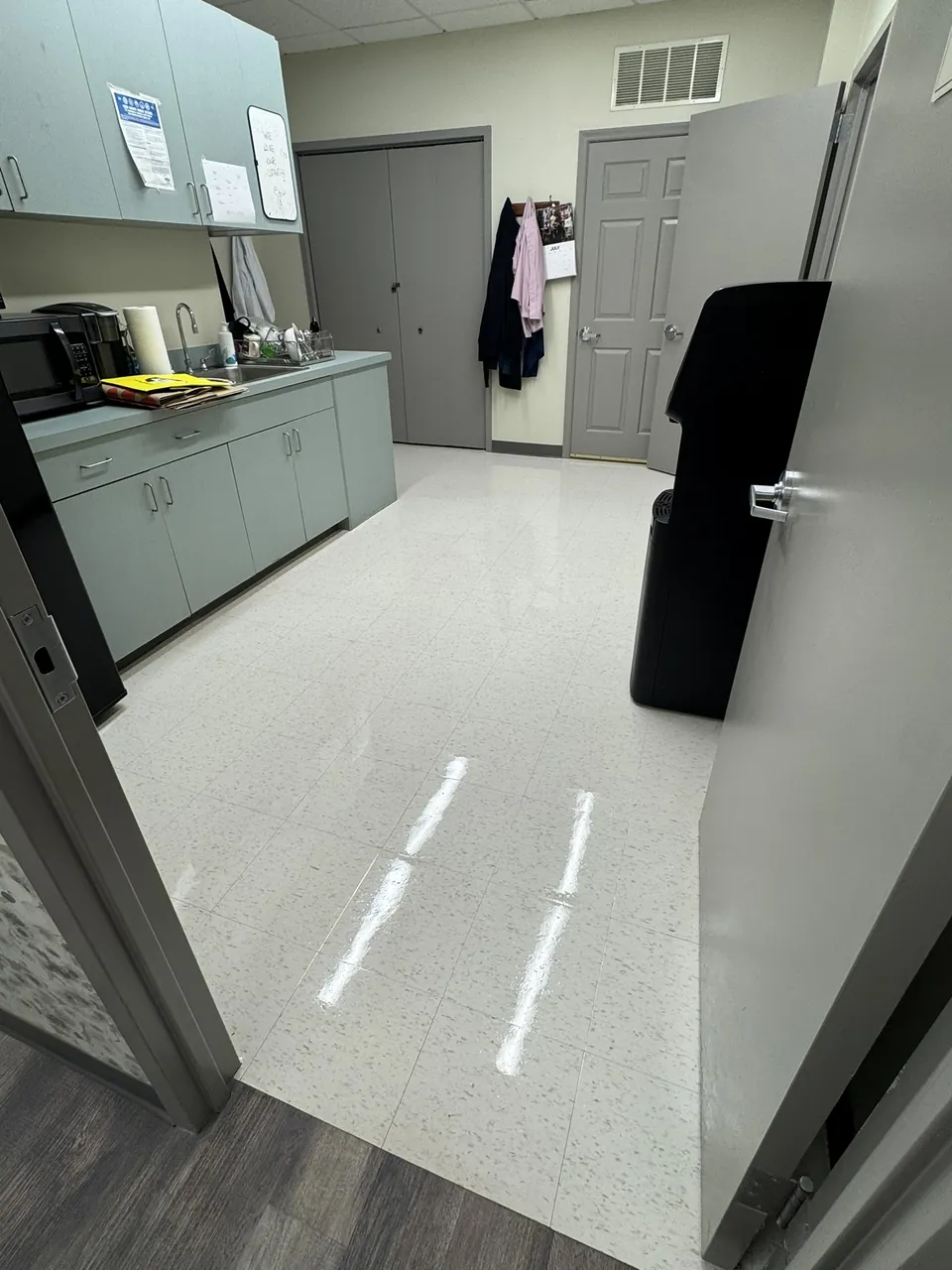 Clean, polished office break room floor maintained by SparkClean