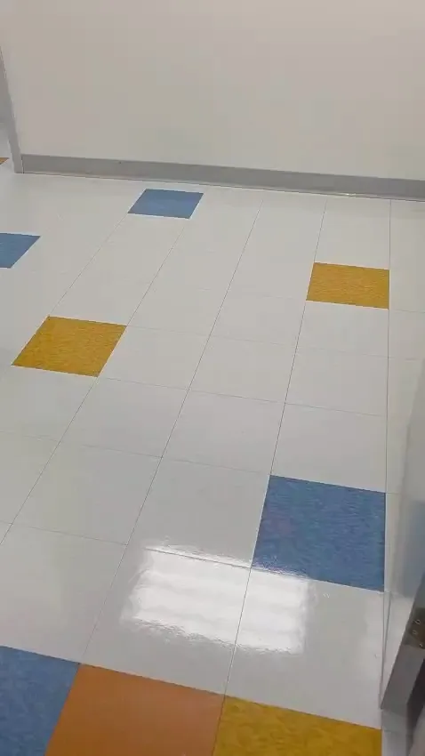 Clean colored tile floor with a bright reflective finish