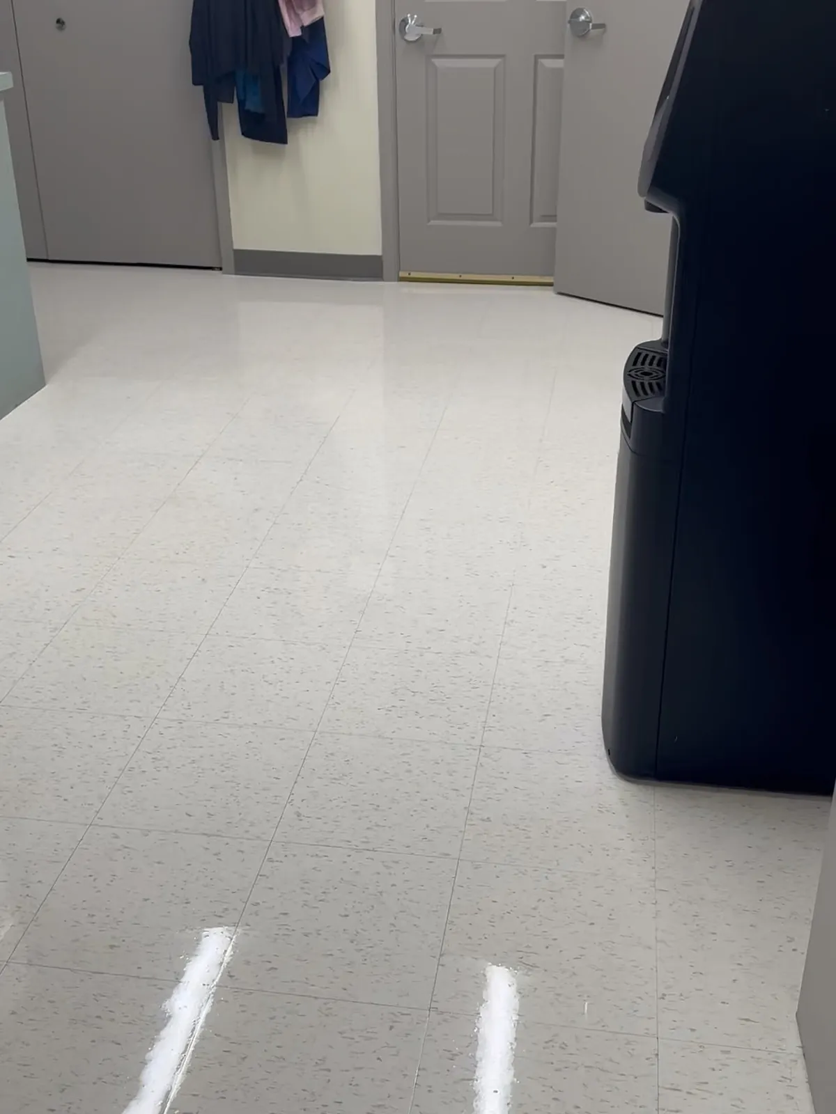 Commercial tile floor after cleaning, clean and lightly polished