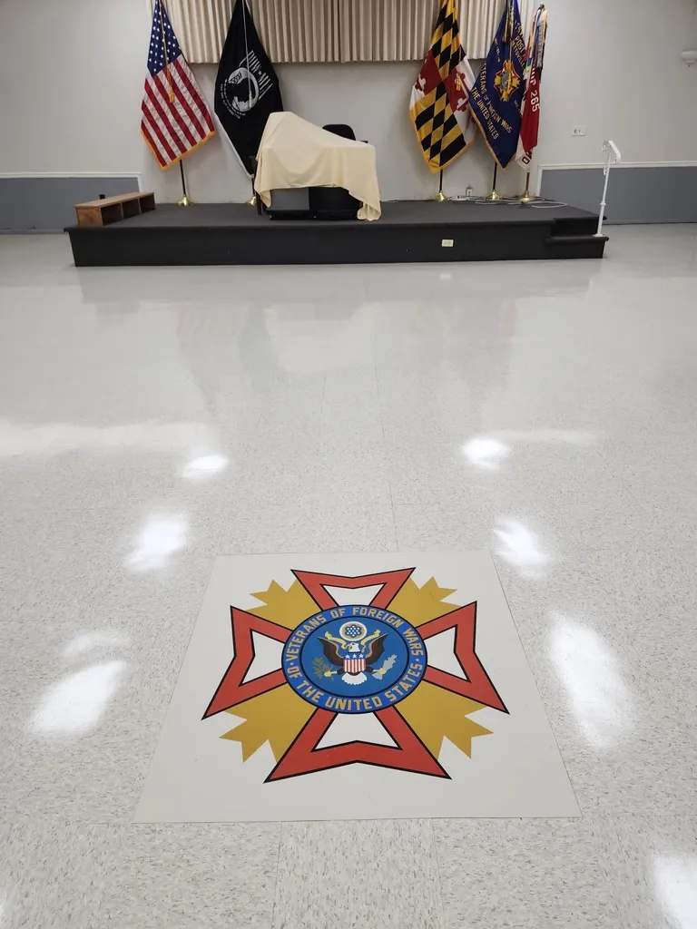 Polished institutional hall floor with a clean reflective finish, maintained by SparkClean