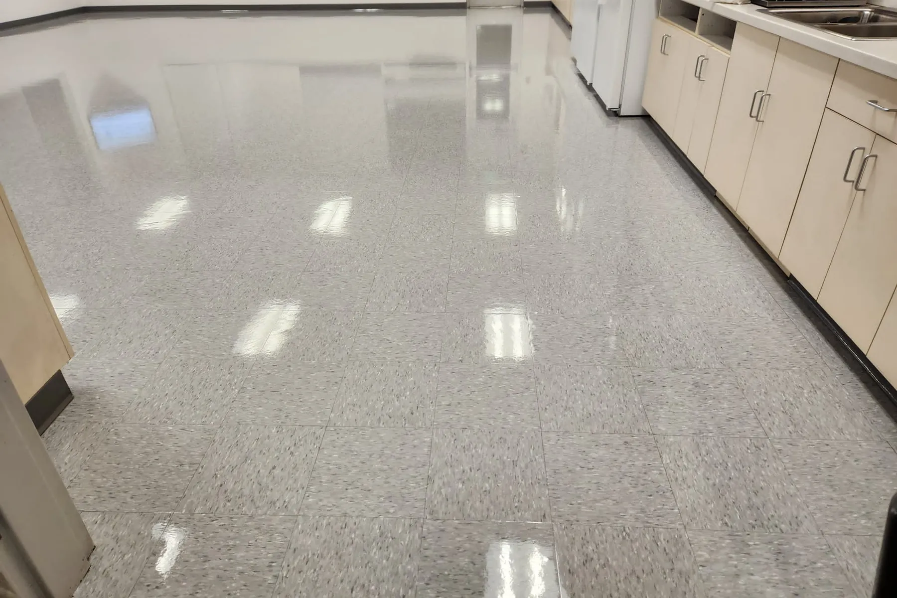 Wide commercial interior floor cleaned by SparkClean