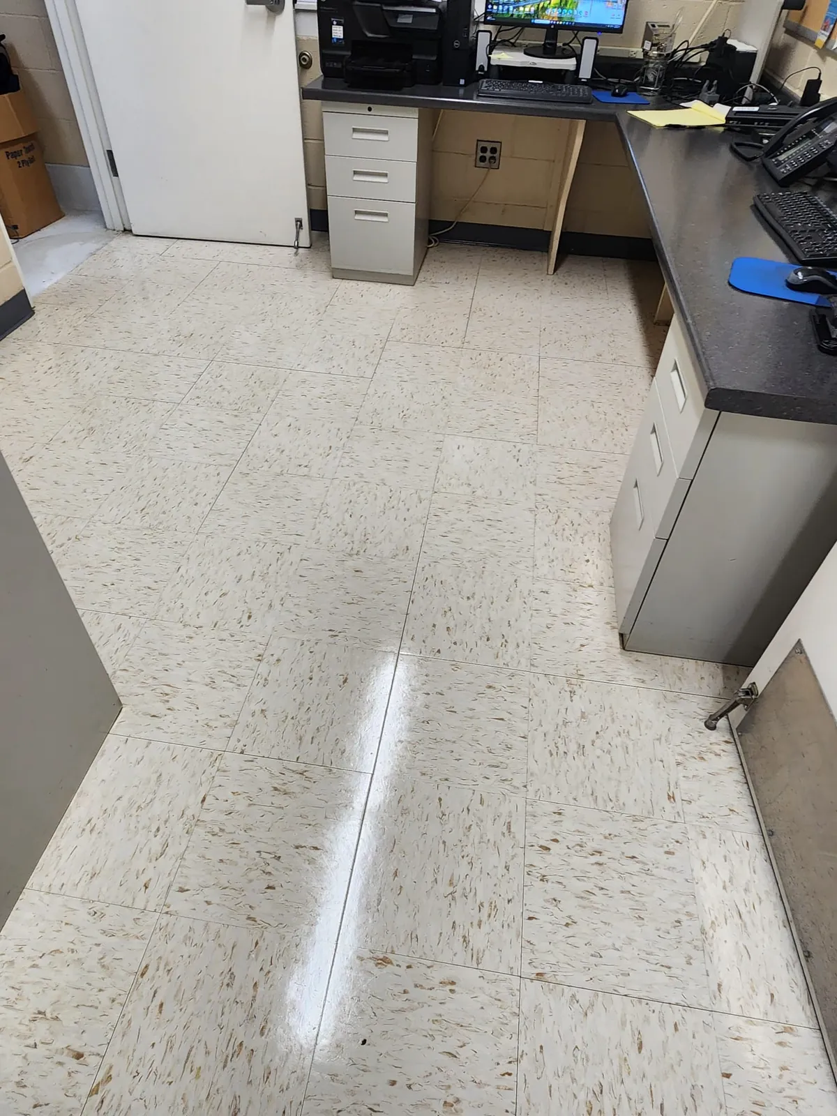 Office kitchenette floor with a clean reflective finish