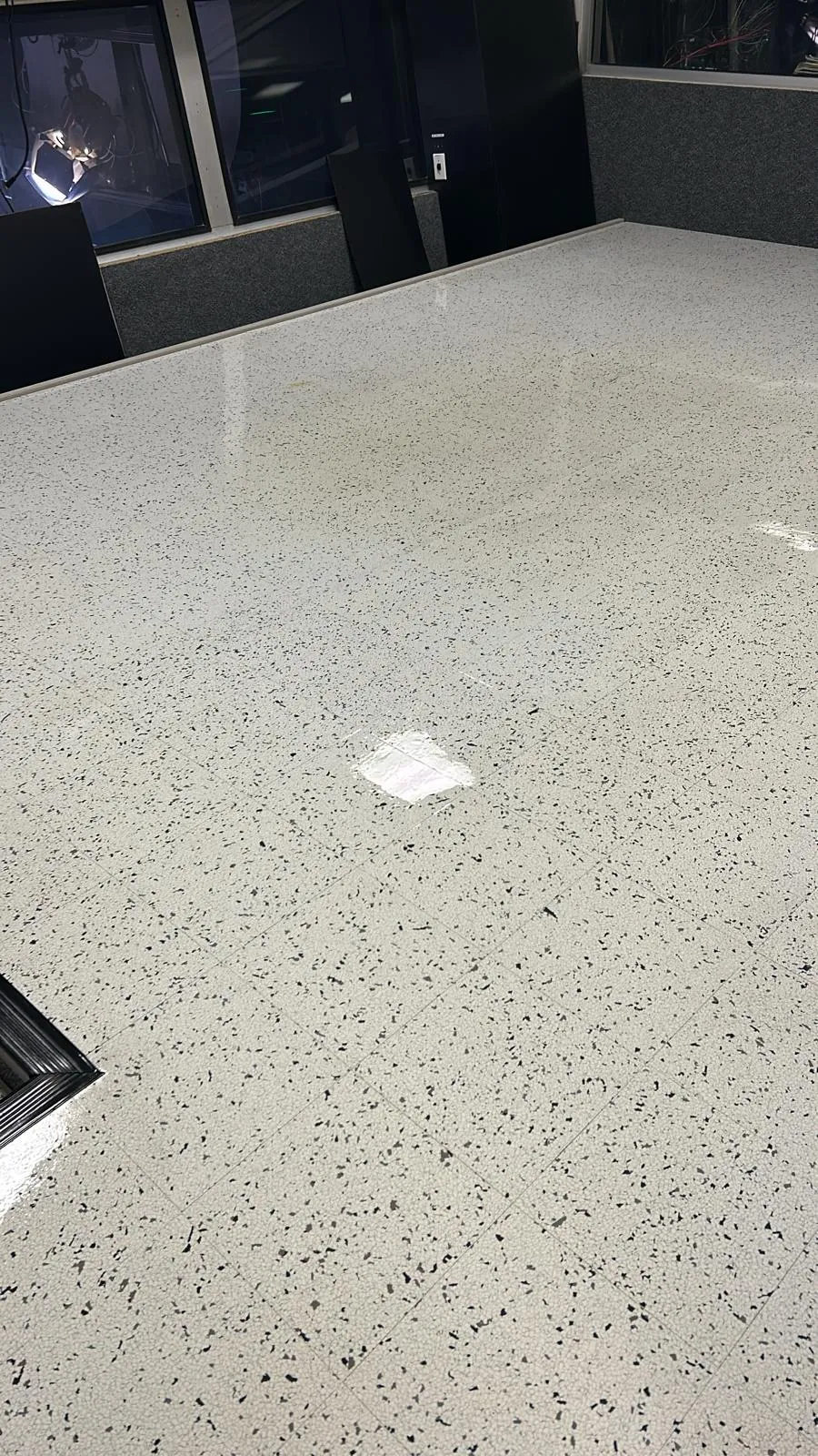 Speckled commercial floor with a clean polished reflection